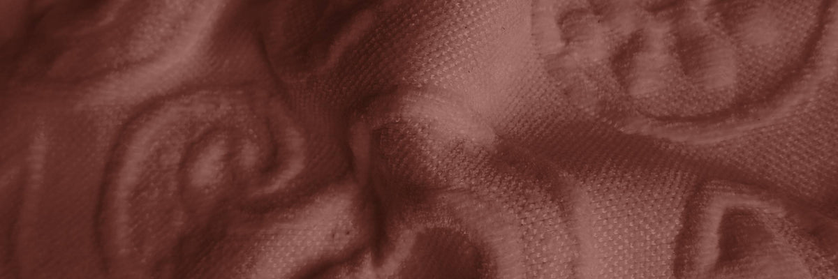 Tessuto Paisley – motivo paisley in rilievo su tessuto bielastico