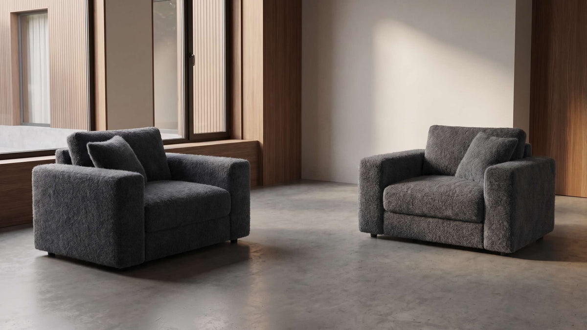 Ambiente con due poltrone rivestite in tessuto Nepal