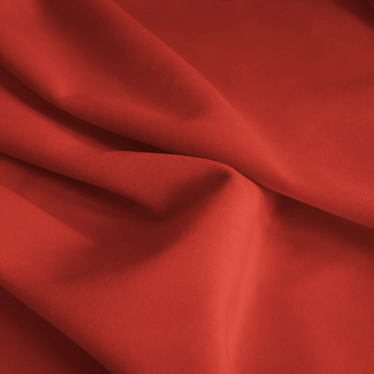 Tessuto Vogue Corallo 030 drappeggiato – velluto idrorepellente effetto cangiante, colore rosso